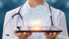 Doctor holding a tablet projecting holographic cloud.